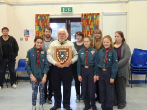 The winning team being presented with the shield